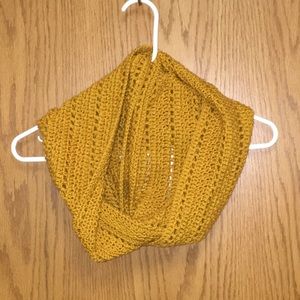 Handmade crocheted infinity scarf in golden yellow